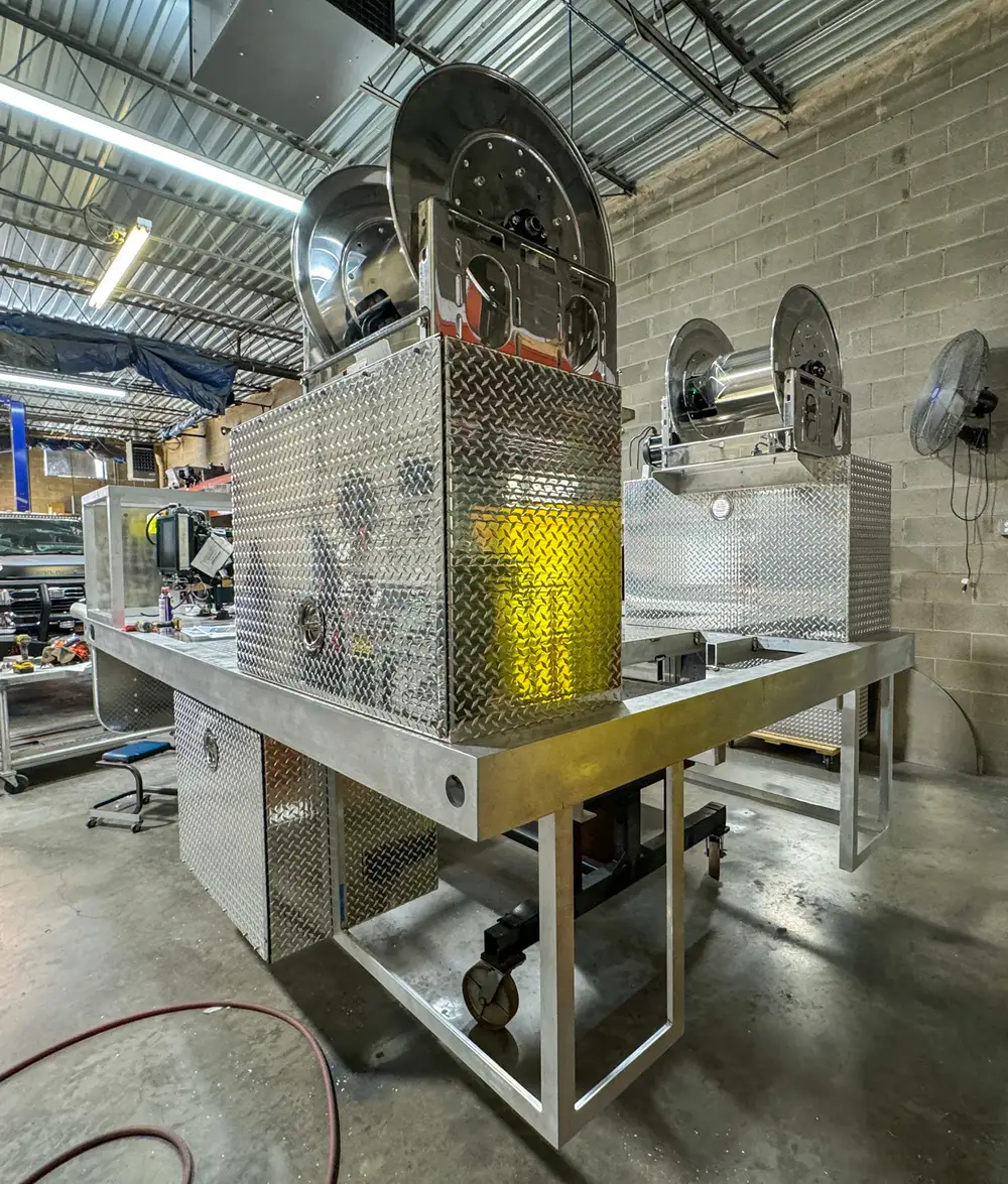 Diamond-plate body and step detail in production, photo 188 of 303.